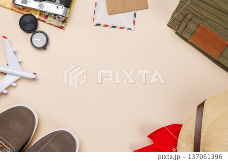 Safari clothing and gear on beige background 137061396