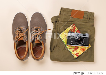 Safari clothing and gear on beige background 137061397