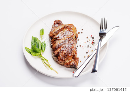 A perfectly cooked striploin steak with a juicy, tender texture A perfectly cooked striploin steak with a juicy, tender texture 137061415