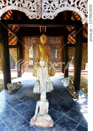Wooden Buddha Sculpture in Traditional Thai Pavilion Chiang Rai Wooden Buddha Sculpture in Traditional Thai Pavilion Chiang Rai 137062600