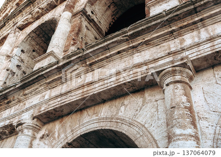 View of ancient structure from low angle with focus on stone details in daylight 137064079