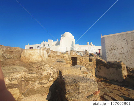 White Church in Mykonos with Tourists under Blue Sky, Greece 137065901