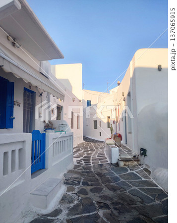 Quiet White Alley with Blue Door in Mykonos Greece Quiet White Alley with Blue Door in Mykonos Greece 137065915