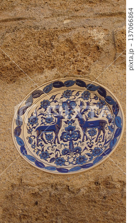 Decorative Ceramic Plates on Stone Wall in Rhodes Old Town Greece 137066864