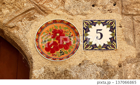 Decorative Ceramic Plates on Stone Wall in Rhodes Old Town Greece Decorative Ceramic Plates on Stone Wall in Rhodes Old Town Greece 137066865