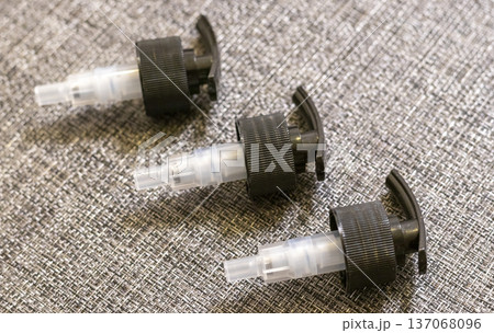 Black Saddle Pumps, which are ideal for dispensing products like body lotions, shampoos, and conditioners from bottles 137068096