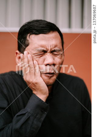 Mature Man Suffering from Severe Toothache Pain and Discomfort 137069687