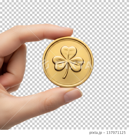 Hand presenting a shiny golden shamrock coin, isolated. Perfect for st. patrick's day wealth, irish luck, and treasure concepts 137071125