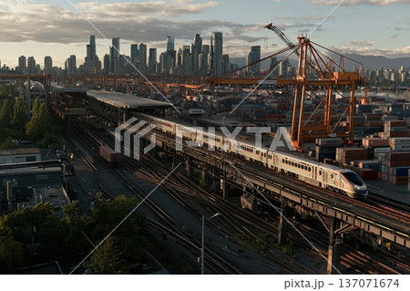 Wide Angle Shot of Cargo Train Departing with City Skyline in Background Wide Angle Shot of Cargo Train Departing with City Skyline in Background 137071674