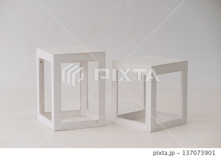 Minimalist White Cube Side Tables in Modern Interior Design with Clean Lines and Geometric Aesthetic Minimalist White Cube Side Tables in Modern Interior Design with Clean Lines and Geometric Aesthetic 137073901