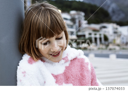 little cute blond girl curious smiling playing outside on sea, lifestyle people concept little cute blond girl curious smiling playing outside on sea, lifestyle people concept 137074033