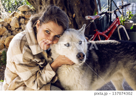 young pretty woman with husky dog outside, lifestyle people concept young pretty woman with husky dog outside, lifestyle people concept 137074302