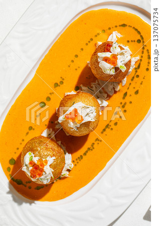 Fried crab croquettes with caviar and sauce 137075734