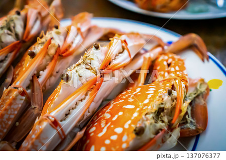 steamed crab in the dish on the old wood table. steamed crab in the dish on the old wood table. 137076377
