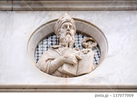 Saint, relief on the facade of Basilica di Santa Croce (Basilica of the Holy Cross) - famous Franciscan church in Florence, Italy 137077009
