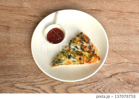 baking pizza topping spinach and on plate dipping ketchup in cup baking pizza topping spinach and on plate dipping ketchup in cup 137078758