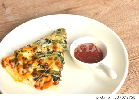 baking pizza topping spinach and on plate dipping ketchup in cup baking pizza topping spinach and on plate dipping ketchup in cup 137078759