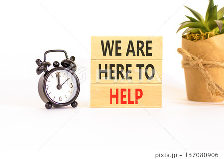 Support, help and we are here to help symbol. Concept words We are here to help on beautiful wooden blocks. Beautiful white background. Alarm clock. Business we are here to help concept. Copy space. Support, help and we are here to help symbol. Concept words We are here to help on beautiful wooden blocks. Beautiful white background. Alarm clock. Business we are here to help concept. Copy space. 137080906