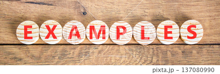 Example examples word symbol. Concept word Examples on beautiful wooden circles. Beautiful wooden background. Business example examples word concept. Copy space. 137080990
