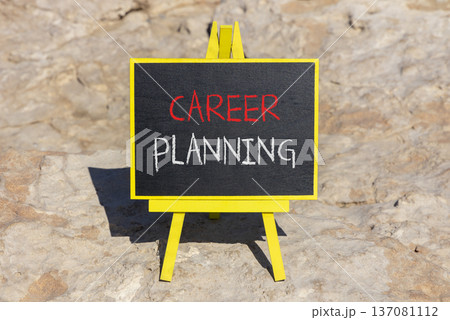 Career planning symbol. Concept words Career planning on beautiful black chalk blackboard. Beautiful sea stone beach background. Business, motivational career planning concept. Copy space. Career planning symbol. Concept words Career planning on beautiful black chalk blackboard. Beautiful sea stone beach background. Business, motivational career planning concept. Copy space. 137081112