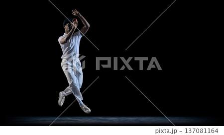 Cricket player jumping mid air with ball on dark stage wearing white uniform 137081164
