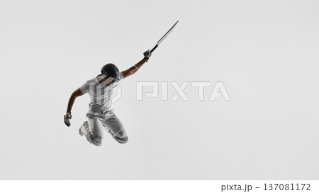 Cricket player airborne with bat raised high on white background. Banner Cricket player airborne with bat raised high on white background. Banner 137081172