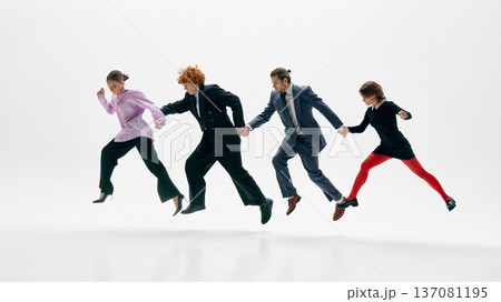 Fashion forward business team jumping together in formal suits on white studio background. Fashion forward business team jumping together in formal suits on white studio background. 137081195