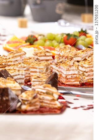 Assorted layered cakes and pastries table Assorted layered cakes and pastries table 137081200