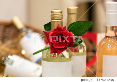 Red rose on wine bottles, romantic concept Red rose on wine bottles, romantic concept 137081230