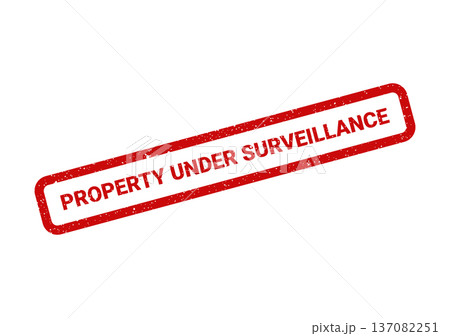 A red rectangular textured rubber stamp with the bold phrase property under surveillance for security warnings 137082251