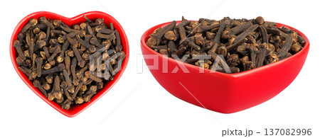 dry spice cloves in ceramic bowl isolated on white background. Top view. Flat lay 137082996
