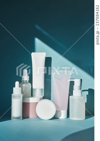 Skincare cosmetic products showcase with natural light and shadow Skincare cosmetic products showcase with natural light and shadow 137084162