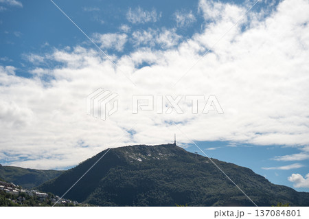 Ulriken mountain peak with TV mast under dramatic sky Ulriken mountain peak with TV mast under dramatic sky 137084801