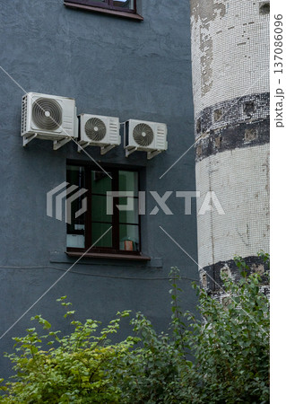 air conditioning on facade of building, air cooling in hot weather.  137086096