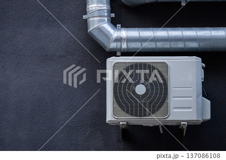 air conditioning on facade of building, air cooling in hot weather.  137086108