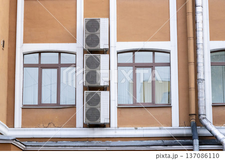 air conditioning on facade of building, air cooling in hot weather.  137086110