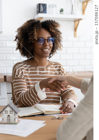 handshake between two people, conclusion of contract for sale of real estate. handshake between two people, conclusion of contract for sale of real estate. 137086127