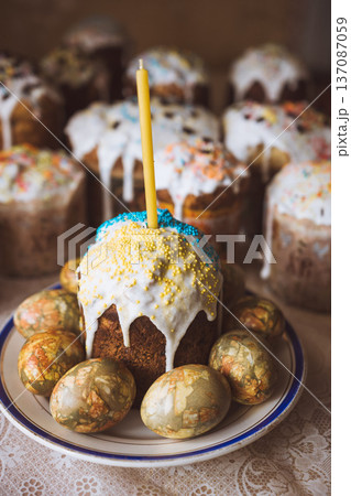 Easter cakes and golden eggs on a wooden table. Selective focus. 137087059