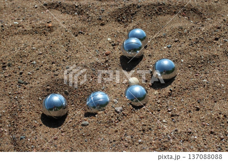 Shiny steel balls in the sand 137088088