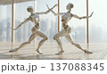 Two humanoid robots in dynamic poses performing a dance routine inside a modern studio with large windows and a city skyline in the background 137088345