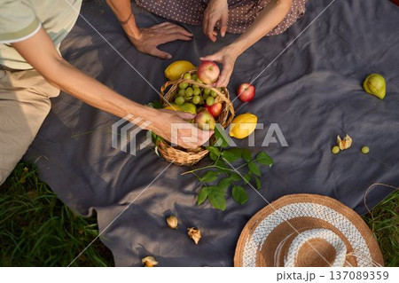 Vibrant picnic setup featuring fresh fruit and artistic food styling Vibrant picnic setup featuring fresh fruit and artistic food styling 137089359