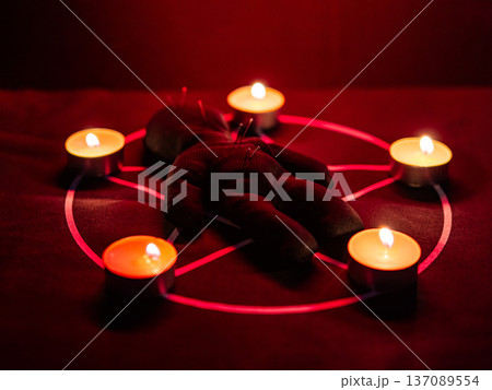 Voodoo doll on a pentagram. Witch spells. 137089554