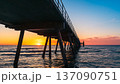 Glenelg jetty silhouette at sunset with warm evening colours 137090751