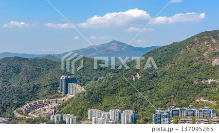Modern hillside residences sit beneath sweeping Kowloon mountain ridge Feb 11 2026 Modern hillside residences sit beneath sweeping Kowloon mountain ridge Feb 11 2026 137095265