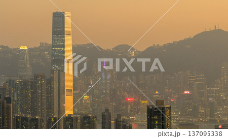 Golden West Kowloon Skyline Framed by Towering Architecture Feb 13 2026 137095338