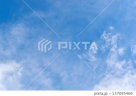 beautiful blue sky and white fluffy group of clouds with sunrise in the morning, natural background beautiful blue sky and white fluffy group of clouds with sunrise in the morning, natural background 137095460