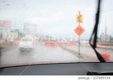 car on highway road with rainny season, blurred image 137095539