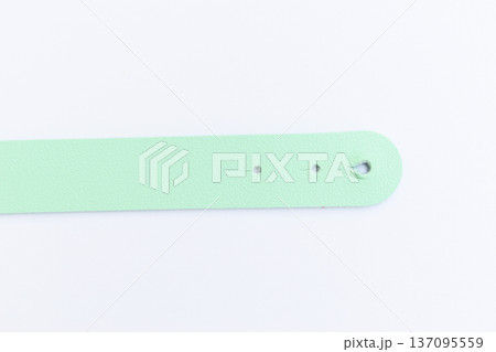 light green leather strap isolated on white background light green leather strap isolated on white background 137095559