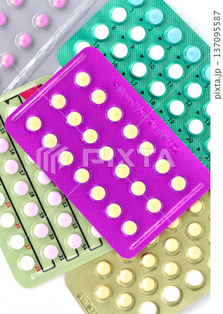 Collection of hormonal birth control pills in different colors and packaging. Collection of hormonal birth control pills in different colors and packaging. 137095587