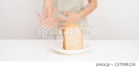 Gluten intolerance, Gluten free and celiac disease or Wheat allergy. woman with wheat bread and having abdominal pain after eat gluten. stomach ache, Nausea, Bloating, Gas, Diarrhea and Skin rash Gluten intolerance, Gluten free and celiac disease or Wheat allergy. woman with wheat bread and having abdominal pain after eat gluten. stomach ache, Nausea, Bloating, Gas, Diarrhea and Skin rash 137096126